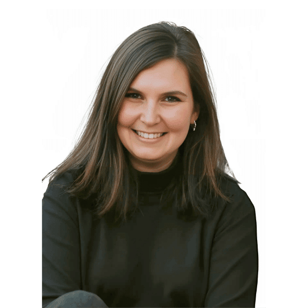 Andrea Fetterly, a woman smiling and ready to help in a therapy office